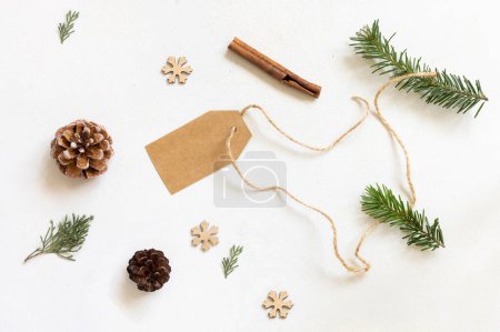 Photo for Blank gift tag, Christmas decor and green fir branches top view, copy space, mockup. Christmas or New Year Holiday atmospheric flat lay - Royalty Free Image
