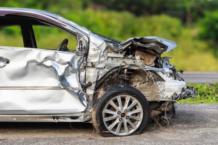 Téléchargez les photos : Front of silver car get hard damaged by accident on the road. Maintenance or car repair concept - en image libre de droit