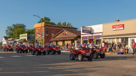 Photo for Battle Lake, Minnesota USA July 23, 2022 Parade in Battle Lake, Minnesota for Wenonga Days celebration. Four wheelers, all-terrain vehicles doing fancy driving in the parade. - Royalty Free Image
