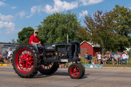 Photo for Mora, Minnesota USA July 30, 2022  Parade in Mora, Minnesota for the Kanabec County Fair. Tractor in the parade. - Royalty Free Image