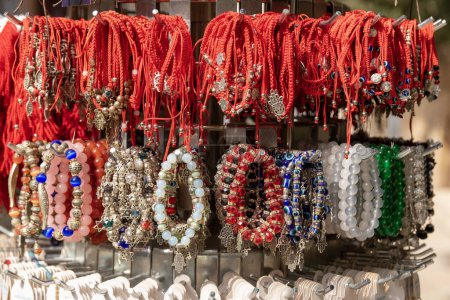 Photo for Jerusalem, Israel February 25,2023 Close up of beautiful colorful bracelets with hamzas against the evil eye sold in the old city in Jerusalem, Israel - Royalty Free Image