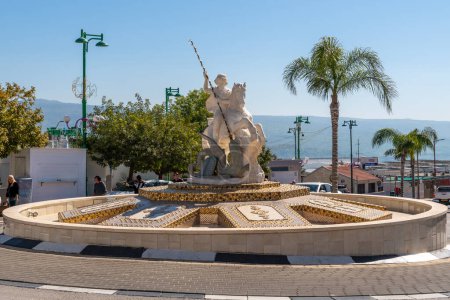 Photo for Ghajar, Israel February 19,2023 A fountain depicting St. George slaying a dragon on the main street of the  village Ghajar also known as Rhadjar an  Alawite-Arab village in Israel on the border with Lebanon - Royalty Free Image