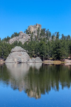 Photo for Reflecion of the rock formations at Sylvan Lake in Custer State Park in the Black Hills of South Dakota, United States. - Royalty Free Image