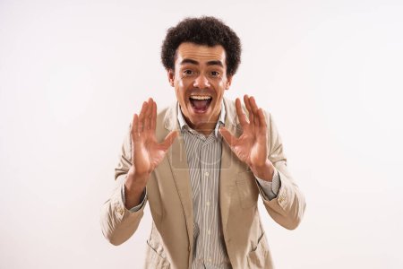 Foto de Image of excited businessman  shouting and announcing something. - Imagen libre de derechos
