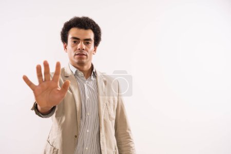 Photo for Portrait of  businessman   showing stop sign. - Royalty Free Image