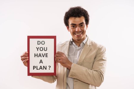 Foto de Imagen del hombre de negocios sosteniendo papel con texto tienes un plan. - Imagen libre de derechos