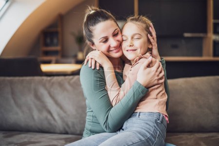 Photo for Happy mother and daughter enjoy spending time together at their home. - Royalty Free Image