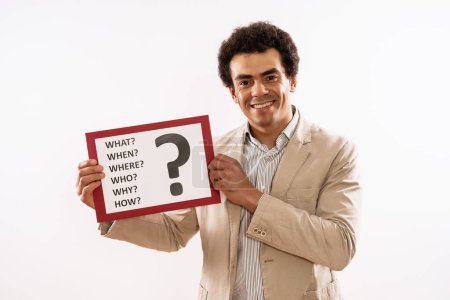 Photo for Image of  businessman holding paper with  question mark and various questions. - Royalty Free Image