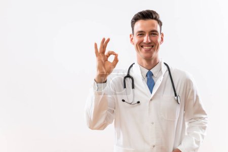 Photo for Portrait of young doctor showing ok sign. - Royalty Free Image