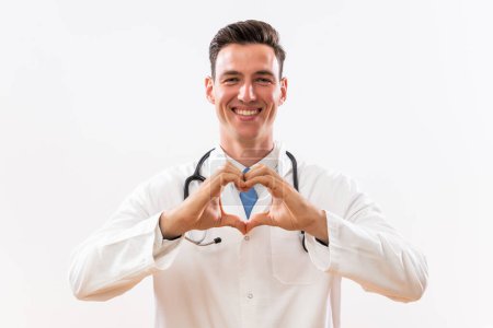 Photo for Portrait of doctor showing heart shape with hands. - Royalty Free Image