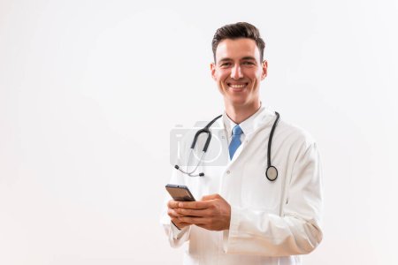 Photo for Image of young doctor using phone. - Royalty Free Image