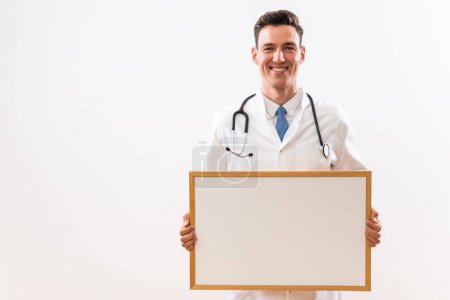 Photo for Image of young doctor holding whiteboard. - Royalty Free Image