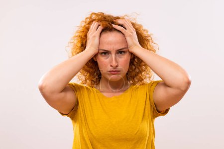 Photo for Portrait of desperate  ginger woman worried because of something. - Royalty Free Image