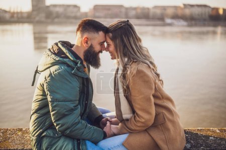 Photo for Happy couple holding hands while enjoy spending time together outdoor. - Royalty Free Image