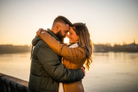 Photo for Happy couple enjoy spending time together outdoor on a sunset. - Royalty Free Image