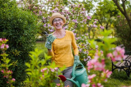 Photo for Portrait of happy senior woman gardening. - Royalty Free Image