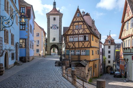 Polnlein in historic old town of Rothenburg ob der Tauber, Germany. Old historic houses and gate towers.