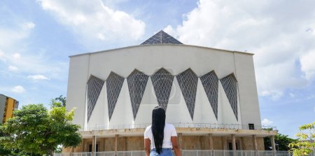 Photo for Woman standing in front of the cathedral in Barranquilla, Colombia - Royalty Free Image