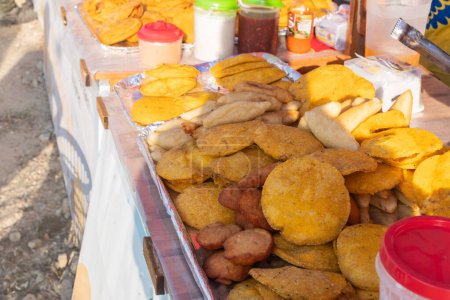 A vibrant spread of various golden-fried street foods.