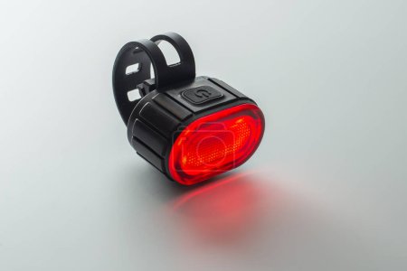 Photo for Red bicycle rear lamp on background. Front view - Royalty Free Image