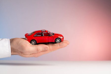 concept : car insurance red car accident in hand.