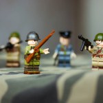 Kyiv, Ukraine. March 9, 2022. LEGO soldiers from Second World War. Toy soldiers in camouflage uniform with machine gun, weapon. Troops, regiment. War in Ukraine. Formations of armed forces, military.