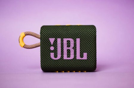 Photo for Kyiv, Ukraine. March 3, 2020. JBL GO 3 acoustic music speaker. Rectangular music playback speaker with purple JBL lettering on lilac background. Beautiful modern stylish musician equipment. A brand. - Royalty Free Image