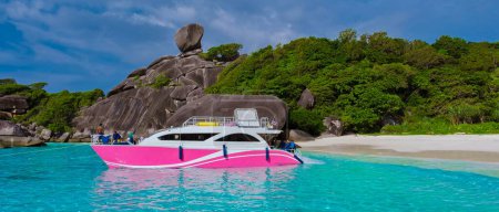 Photo for Tourist boat and Turqouse colored ocean and white beach at the tropical Island Similan Island Thailand with a empty beach - Royalty Free Image