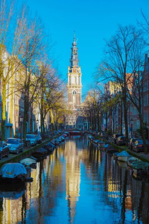 Photo for Amsterdam Netherlands canals with lights during the evening in December during wintertime in the Netherlands Amsterdam city. Europe. - Royalty Free Image
