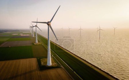 Photo for Windmill turbines seen from a drone bird eye view - Royalty Free Image