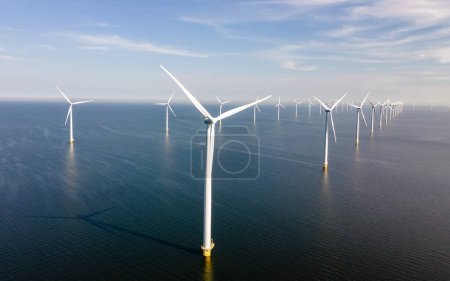 Photo for Windmill turbines generating green energy , energy transition in Europe - Royalty Free Image