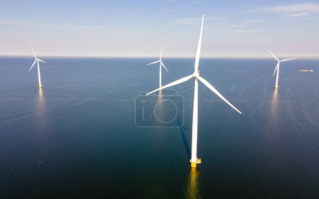 Photo for Windmill turbines generating green energy , energy transition in Europe - Royalty Free Image
