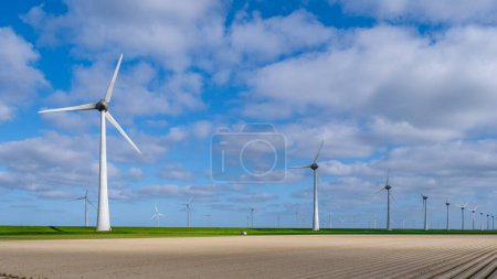 Photo for Drone Aerial view at Windmill park with windmills turbines in the ocean - Royalty Free Image