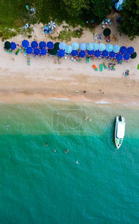 Photo for Drone aerial view at Cozy Beach Pattaya Thailand with people sunbathing on the beach - Royalty Free Image