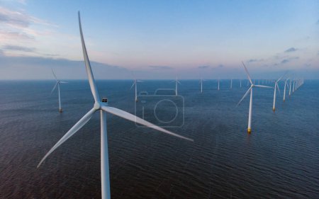 Photo for Windmill park with windmills turbines generating green energy in the Netherlands - Royalty Free Image