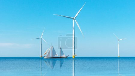Foto de Parque de molinos de viento con turbinas de molino de viento en los Países Bajos vista aérea del parque eólico - Imagen libre de derechos