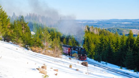 Photo for Steam train during winter in the snow in the Harz national park Germany - Royalty Free Image