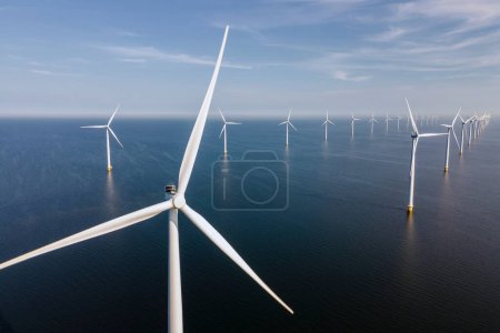 Wind turbine from an aerial view, Drone view at windpark a windmill farm in the lake IJsselmeer the biggest in the Netherlands, Sustainable development, renewable energy.