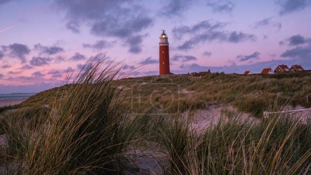 Photo for Texel lighthouse during sunset Netherlands Dutch Island Texel Holland during summer - Royalty Free Image