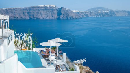 Photo for Santorini Oia village during sunset whit luxury hotels and whitewashed buildings in Santorini Island a luxury vacation destination in Greece Europe September 2018 - Royalty Free Image