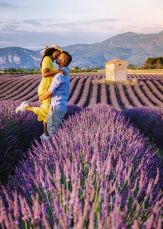 Provence, Lavender field France, Valensole Plateau, colorful field of Lavender Provence, Southern France. Lavender field. Europe. Couple men and woman on vacation at the provence lavender fields,