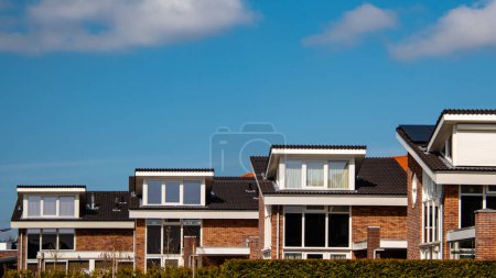 Photo for Dutch Suburban area with modern family houses, newly build modern family homes in the Netherlands, dutch family house, housing market - Royalty Free Image