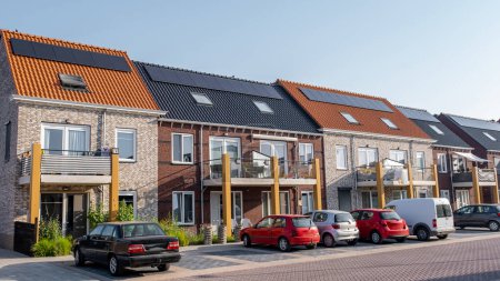 Photo for Newly build houses with solar panels attached on the roof against a sunny sky, housing market in the Netherlands - Royalty Free Image