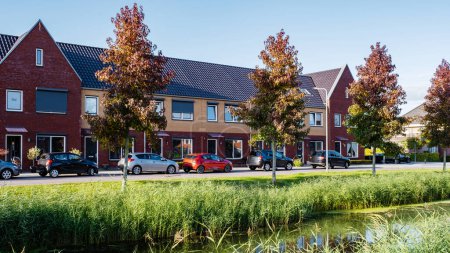Photo for Dutch Suburban area with modern family houses, newly build modern family homes in the Netherlands, dutch family house, housing market - Royalty Free Image