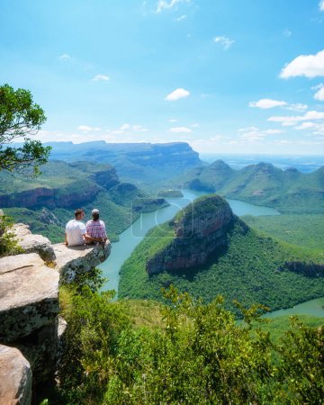 Téléchargez les photos : Panorama Route South Africa, Blyde river canyon with the three rondavels, view of three rondavels and the Blyde river canyon in South Africa. Asian women and Caucasian men on vacation in South Africa - en image libre de droit
