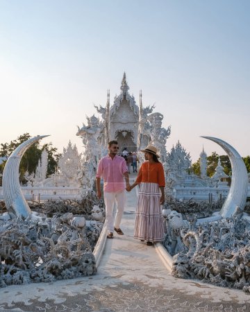 Photo for A couple of men and women visit the White Temple Chiang Rai Thailand, Wat Rong Khun Northern Thailand. - Royalty Free Image