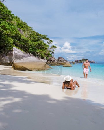 Photo for Couple on a boat trip to the tropical Similan Islands in Southern Thailand. Men and women on the beach of Similan Islands - Royalty Free Image