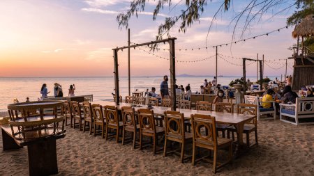 Photo for Na Jomtien Beach Pattaya Thailand December 2021, white tropical beach during sunset in Pattaya Najomtien at the Glasshouse famous restaurant - Royalty Free Image