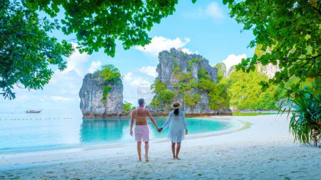 Photo for Koh Hong Island Krabi Thailand, a couple of men and women on the beach of Koh Hong during a vacation in Thailand on a summer day - Royalty Free Image