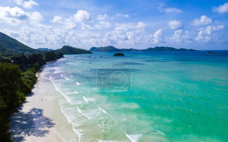 Photo for Drone view from above at a tropical beach in Seychelles. Anse Volbert beach Praslin with granite boulders rocks - Royalty Free Image